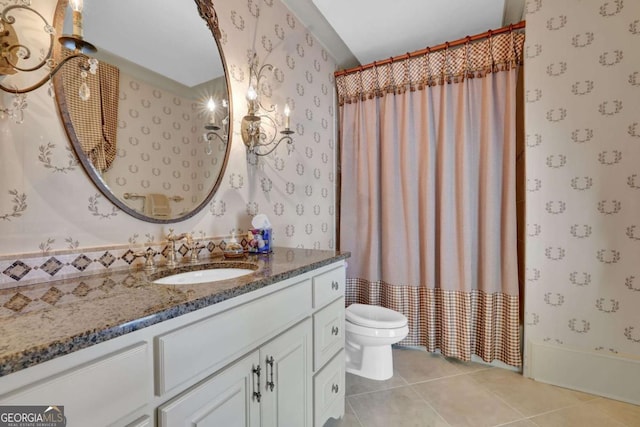 full bathroom featuring tile patterned floors, toilet, vanity, and wallpapered walls