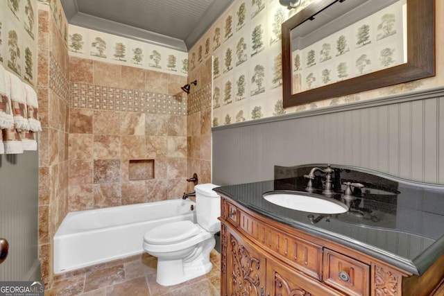 bathroom with wallpapered walls, a wainscoted wall, toilet, shower / tub combination, and vanity