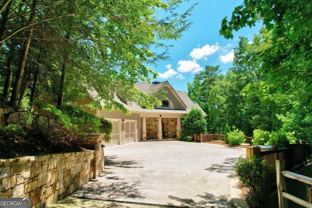 exterior space featuring concrete driveway