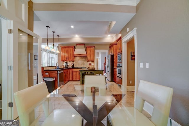 dining space with recessed lighting and crown molding