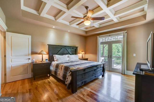 bedroom featuring coffered ceiling, access to outside, french doors, light wood finished floors, and beamed ceiling