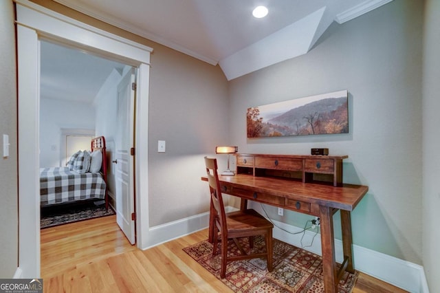 office space with baseboards, wood finished floors, and ornamental molding