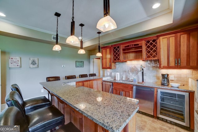 kitchen with a tray ceiling, wine cooler, fridge, and decorative backsplash