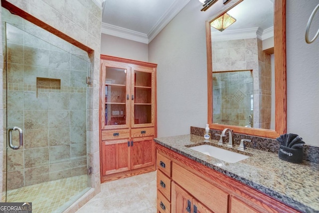 bathroom with ornamental molding and a shower stall