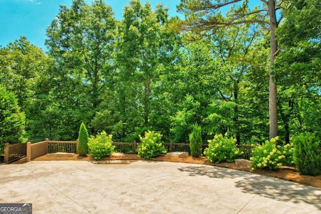 view of patio featuring fence