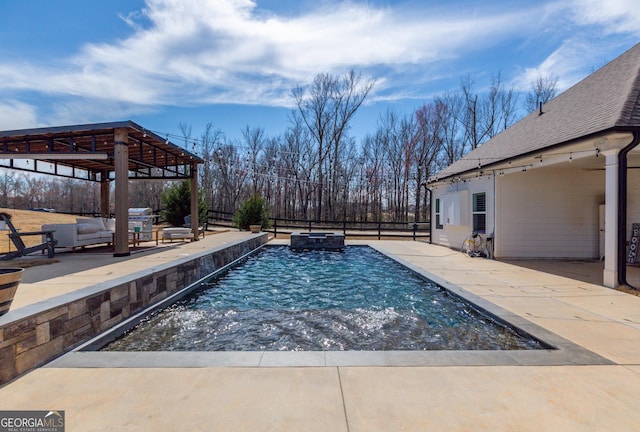 view of swimming pool with a patio, fence, a gazebo, a pool with connected hot tub, and outdoor lounge area