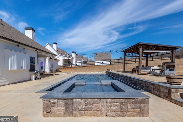 view of pool featuring a patio area, a fenced backyard, and area for grilling