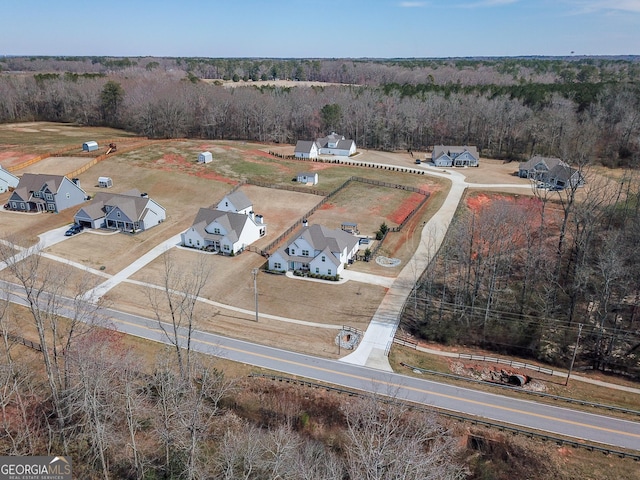 bird's eye view featuring a wooded view