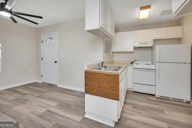 kitchen featuring white cabinetry, a sink, light wood-type flooring, white appliances, and under cabinet range hood