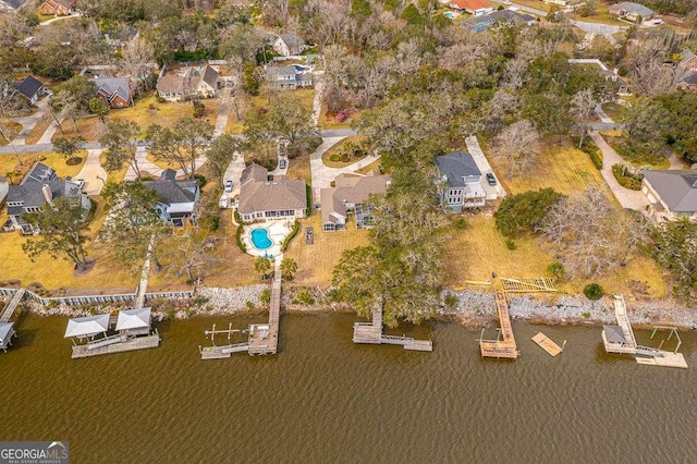 aerial view with a residential view and a water view