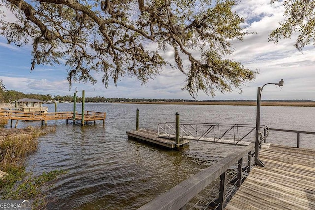 dock area with a water view