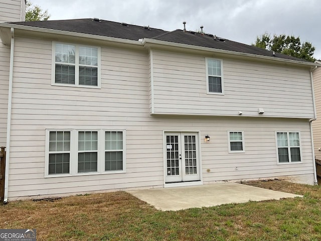 back of house with a yard, a chimney, and a patio