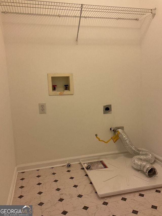 washroom featuring washer hookup, electric dryer hookup, laundry area, baseboards, and tile patterned floors