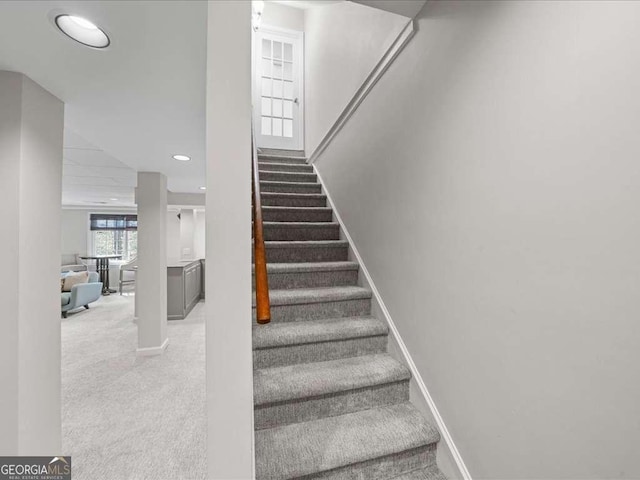 stairway with carpet, baseboards, and recessed lighting