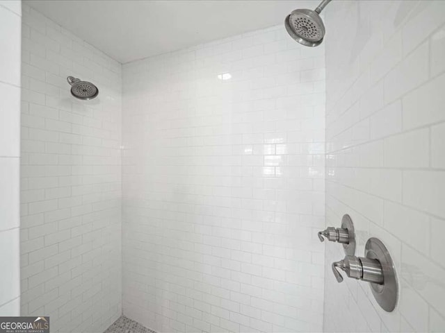 full bath featuring a tile shower