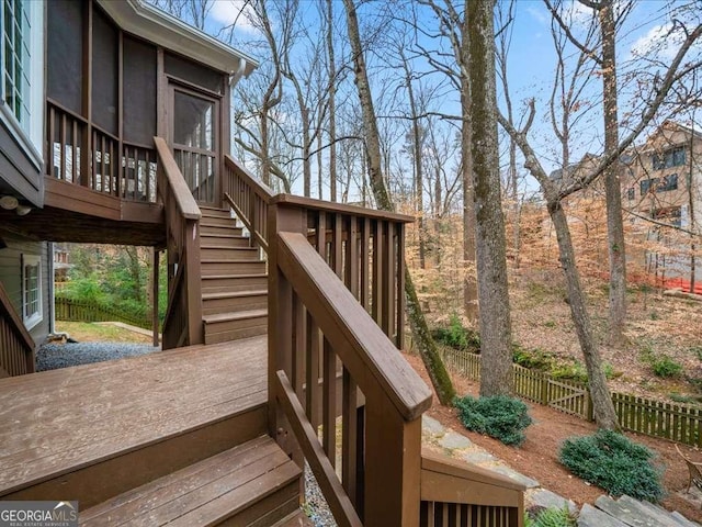 wooden terrace featuring fence and stairway