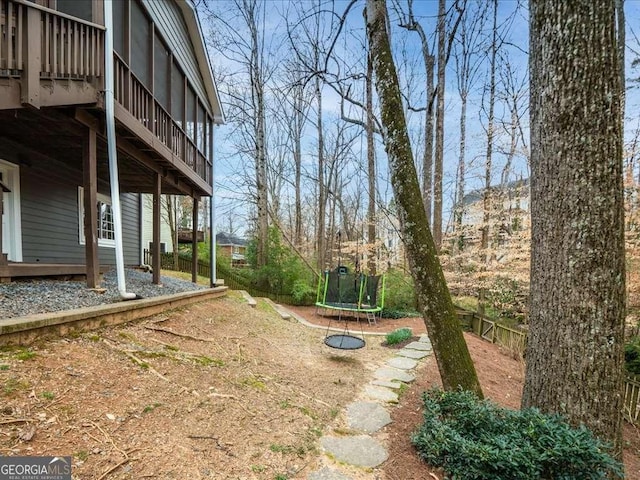 view of yard featuring a trampoline