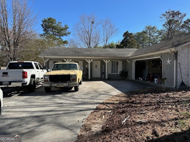 ranch-style house with driveway and an attached garage