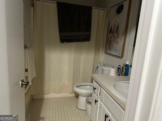 bathroom featuring vanity, toilet, and tile patterned floors