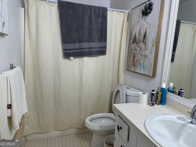 full bathroom with toilet, vanity, and tile patterned floors