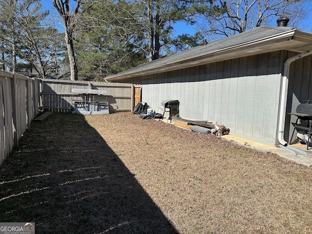 view of yard with a fenced backyard