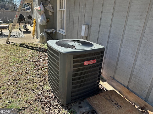 details featuring fence and cooling unit