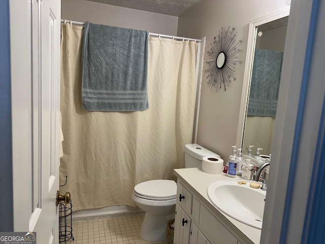 full bath with a textured ceiling, vanity, toilet, and tile patterned floors