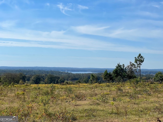 property view of mountains featuring a view of trees