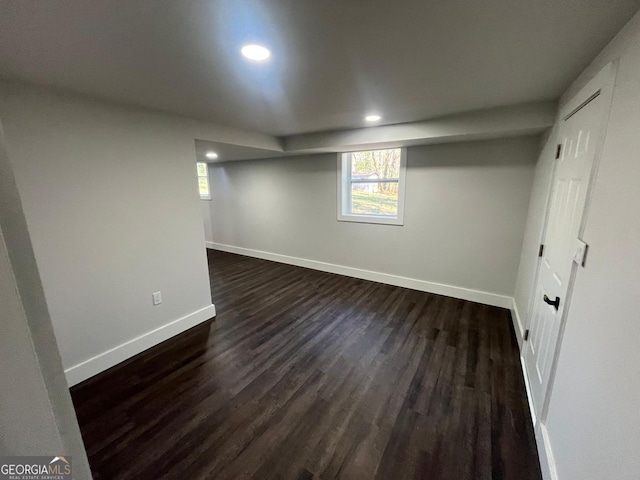 basement with dark wood-style floors, recessed lighting, and baseboards