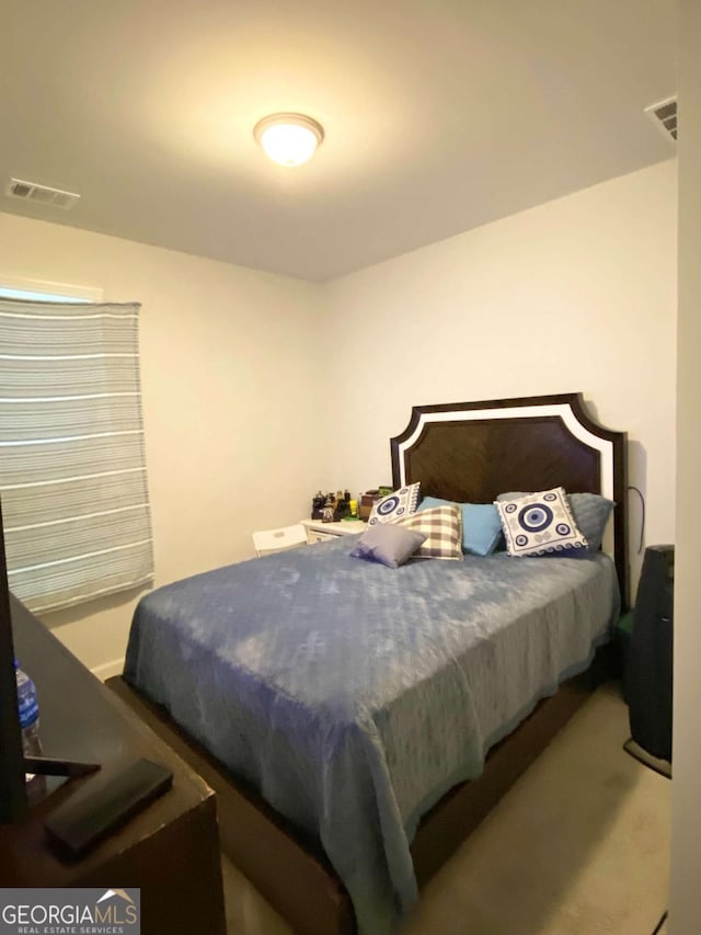 bedroom with visible vents