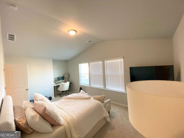 bedroom with lofted ceiling, carpet, visible vents, and baseboards