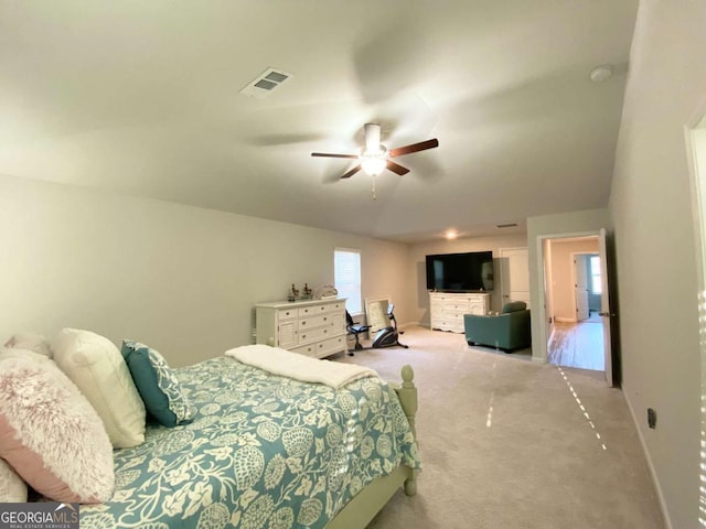 bedroom with ceiling fan, carpet, visible vents, and baseboards