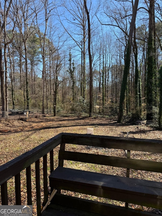 view of yard with a view of trees