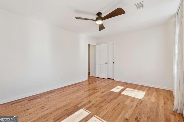 unfurnished bedroom with baseboards, ceiling fan, visible vents, and light wood-style floors