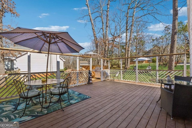 wooden deck with outdoor dining area