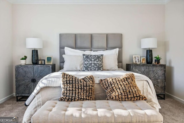 bedroom with carpet and baseboards