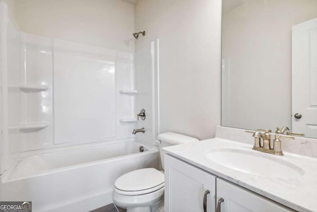 bathroom featuring shower / tub combination, vanity, and toilet