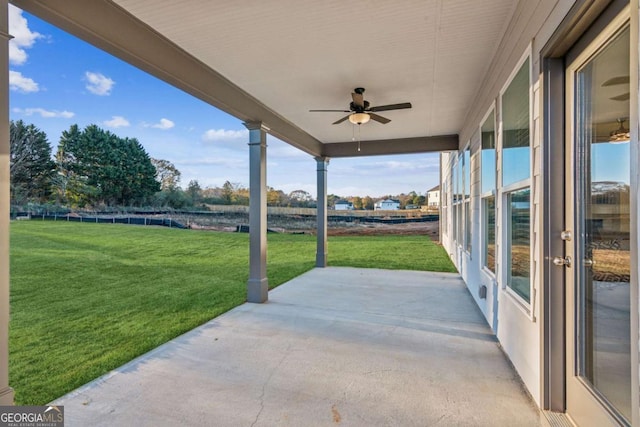 view of patio featuring ceiling fan