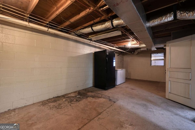 basement with freestanding refrigerator