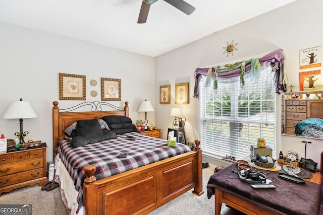 bedroom featuring ceiling fan and light colored carpet