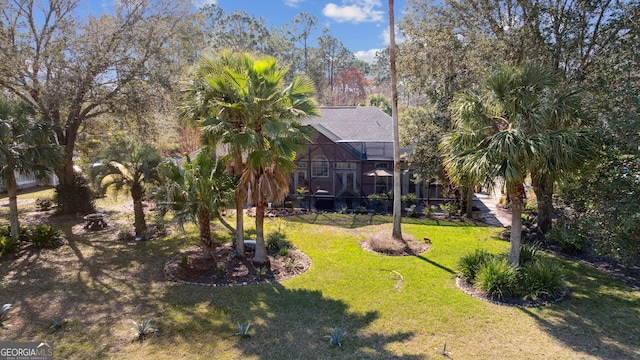 view of yard featuring a lanai