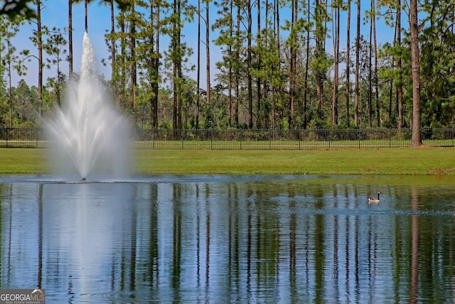 view of water feature with fence