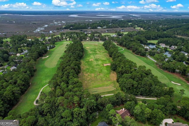 birds eye view of property featuring view of golf course and a water view