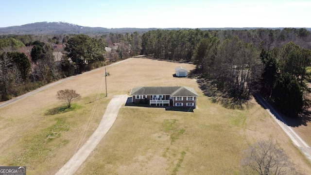 bird's eye view featuring a forest view