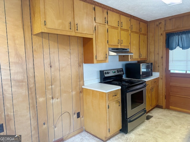 kitchen featuring stainless steel range with electric cooktop, ventilation hood, a textured ceiling, light countertops, and black microwave