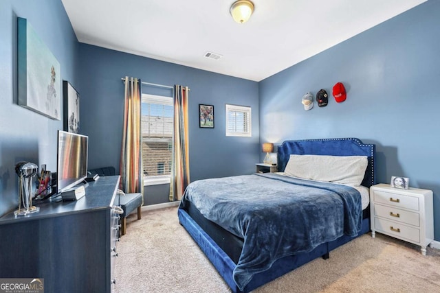 bedroom featuring baseboards, visible vents, and carpet flooring