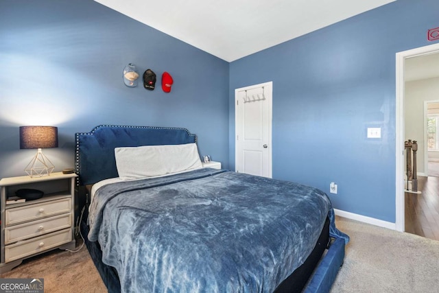 bedroom with carpet and baseboards