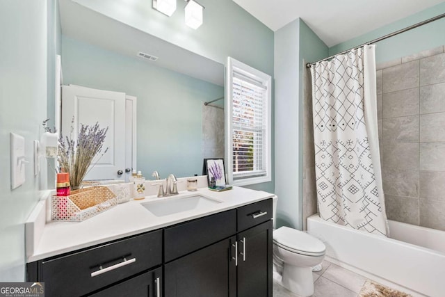 full bathroom with visible vents, shower / bathtub combination with curtain, toilet, vanity, and tile patterned floors