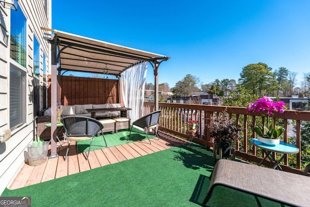 wooden terrace featuring an outdoor living space and a pergola