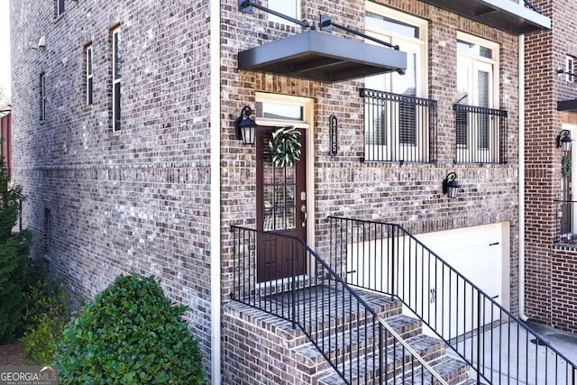 doorway to property featuring a balcony